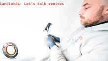 image of an electrician rewiring a socket